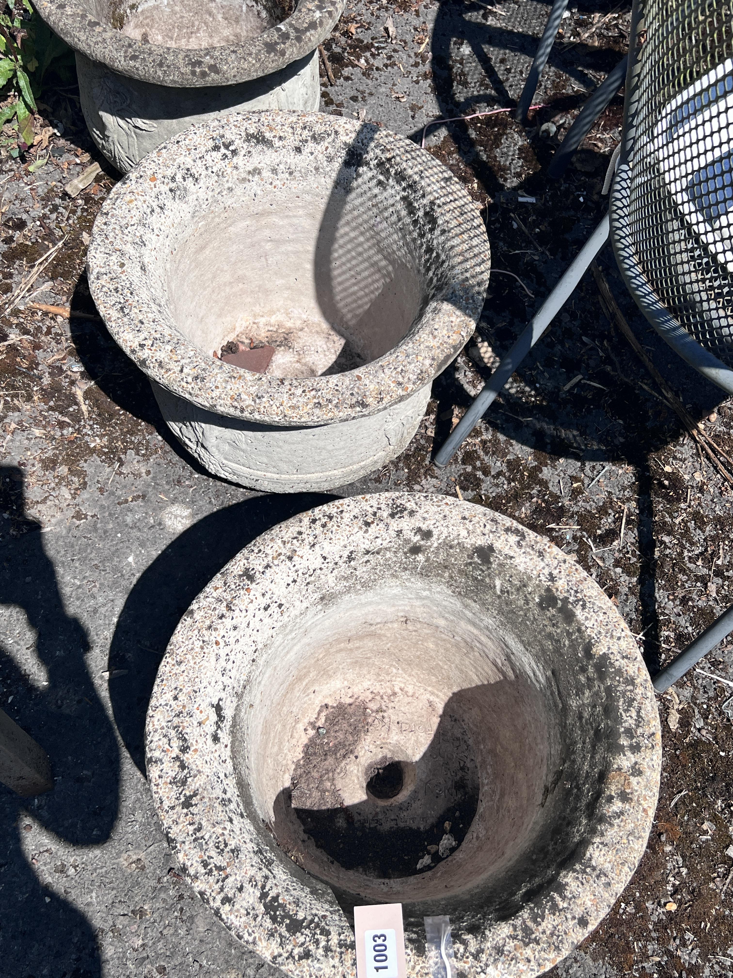 A set of four circular reconstituted stone garden planters, diameter 41cm, height 28cm